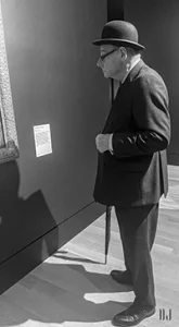 Man in Bowler Hat at art gallery in London